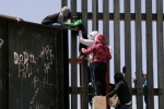 entering US via mexico, punjabis crossing mexico border, video clip shows punjabi women children crossing border fence into u s, Us mexico border